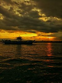 Scenic view of sea against dramatic sky