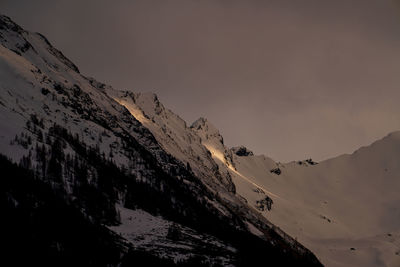 Scenic view of snowcapped mountains against sky during winter