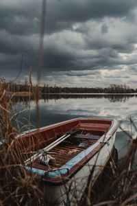 Boats moored at harbor