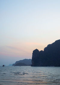 Scenic view of sea against clear sky during sunset