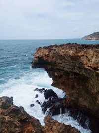 The waves hit a cliff on the island of timang, gunung kidul regency yogyakarta-indonesia