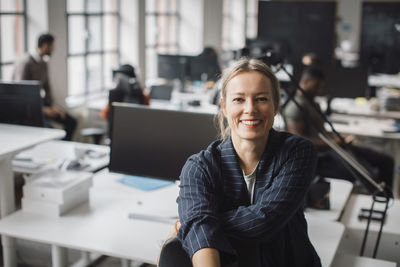 Portrait of businesswoman smiling at office