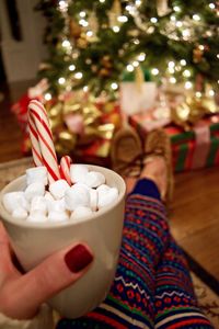 Low section of woman holding ice cream