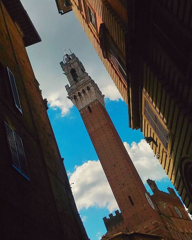 architecture, built structure, low angle view, building exterior, sky, building, day, blue, cloud, cloud - sky, tall - high, sunlight, window, city, outdoors, no people, tower, tilt, residential building, residential structure