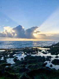 Scenic view of sea against sky during sunset