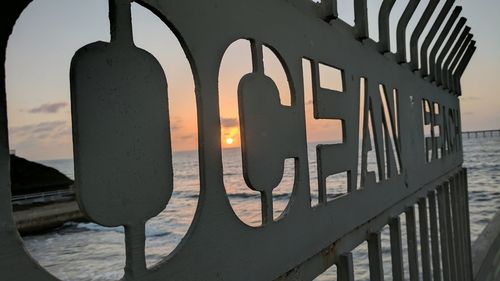 Close-up of sea against sky during sunset