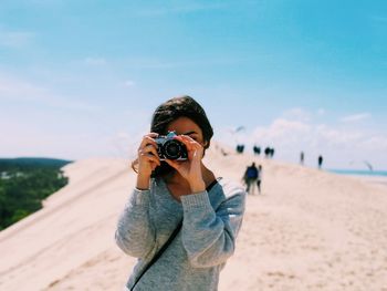 Man photographing with camera