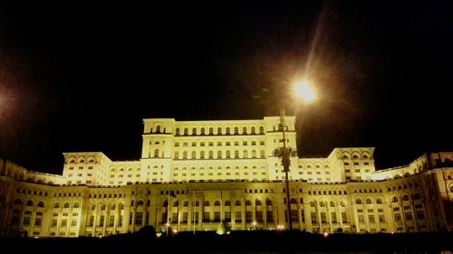 Buildings in city at night