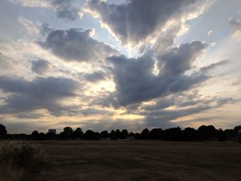 Scenic view of field against sky during sunset