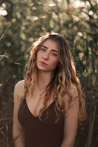 Portrait of a beautiful young woman standing outdoors