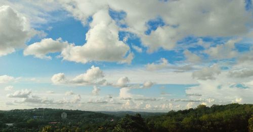 Scenic view of landscape against cloudy sky