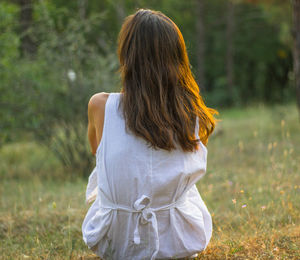 Rear view of woman on field