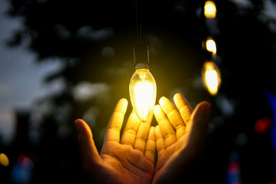Close-up of illuminated light bulb