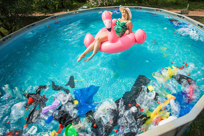 High angle view of people swimming in pool