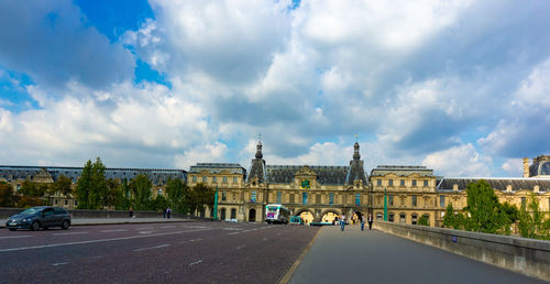 City street against cloudy sky