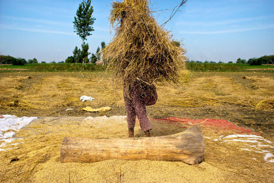 Full length of man on field against sky