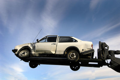 Low angle view of car against sky