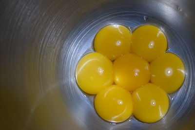 High angle view of yellow eggs