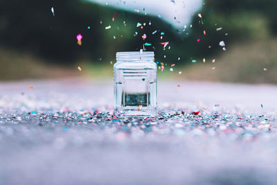 Close-up of jar on the ground