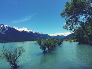 Scenic view of lake against cloudy sky