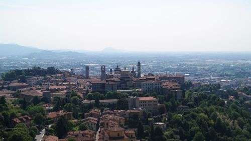 High angle view of buildings in city against sky