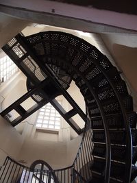 Low angle view of spiral staircase in building