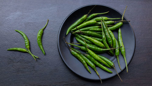 High angle view of red chili peppers on table