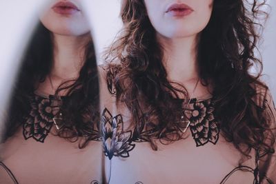Midsection of woman with eyes closed