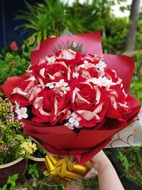 Close-up of hand holding bouquet