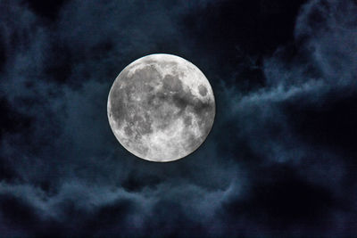 Low angle view of moon against sky at night