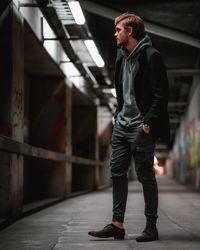 Full length of man standing in corridor