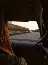 Close-up of car on road against sky