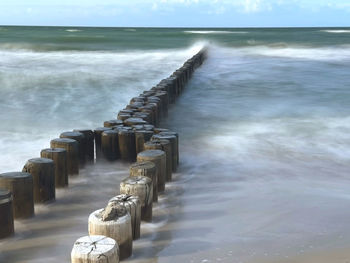Pier over sea against sky