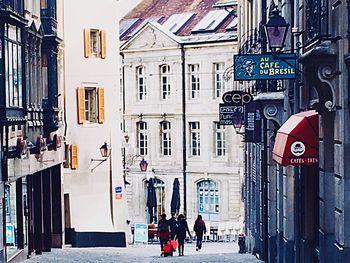 People walking in front of building