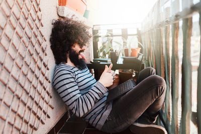 Man sitting on mobile phone
