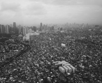 Aerial view of cityscape against sky