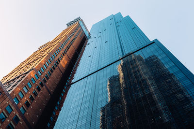 Low angle view of modern buildings against clear sky