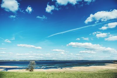 Scenic view of sea against cloudy sky