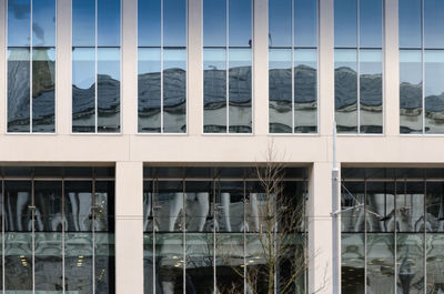 Reflection of building on glass window