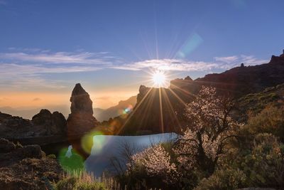 Scenic view of mountains against sky during sunset