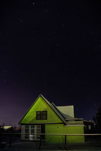 Low angle view of house against sky at night