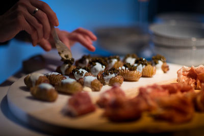 Midsection of person preparing food on table