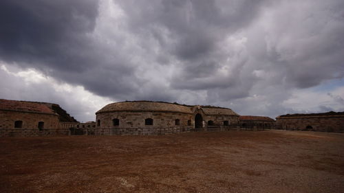 Old ruin against cloudy sky