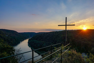 Scenic view of cross against sky during sunset