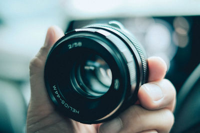 Close-up of hand holding camera