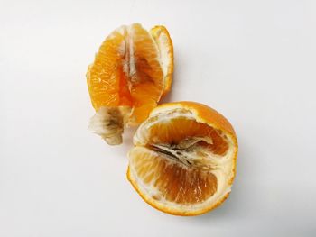 Close-up of orange slice against white background