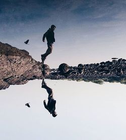 Low angle view of woman jumping