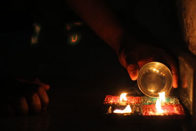 Close-up of illuminated hands