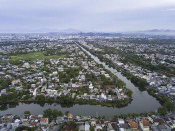 High angle view of river amidst buildings in city