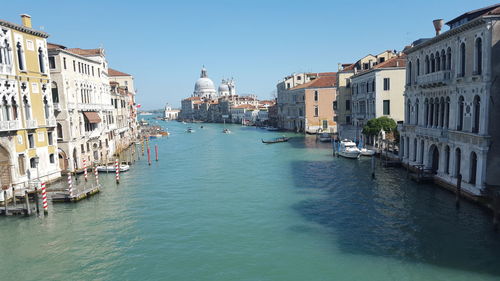 Canal passing through city buildings